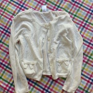 White sweater. New with tags. Cute embellishments